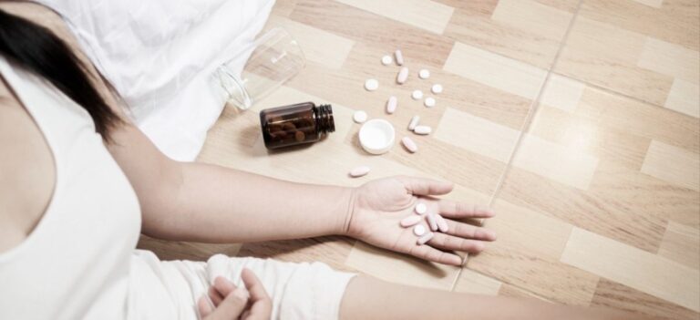 a woman holds pills and wonders what's really in your drugs