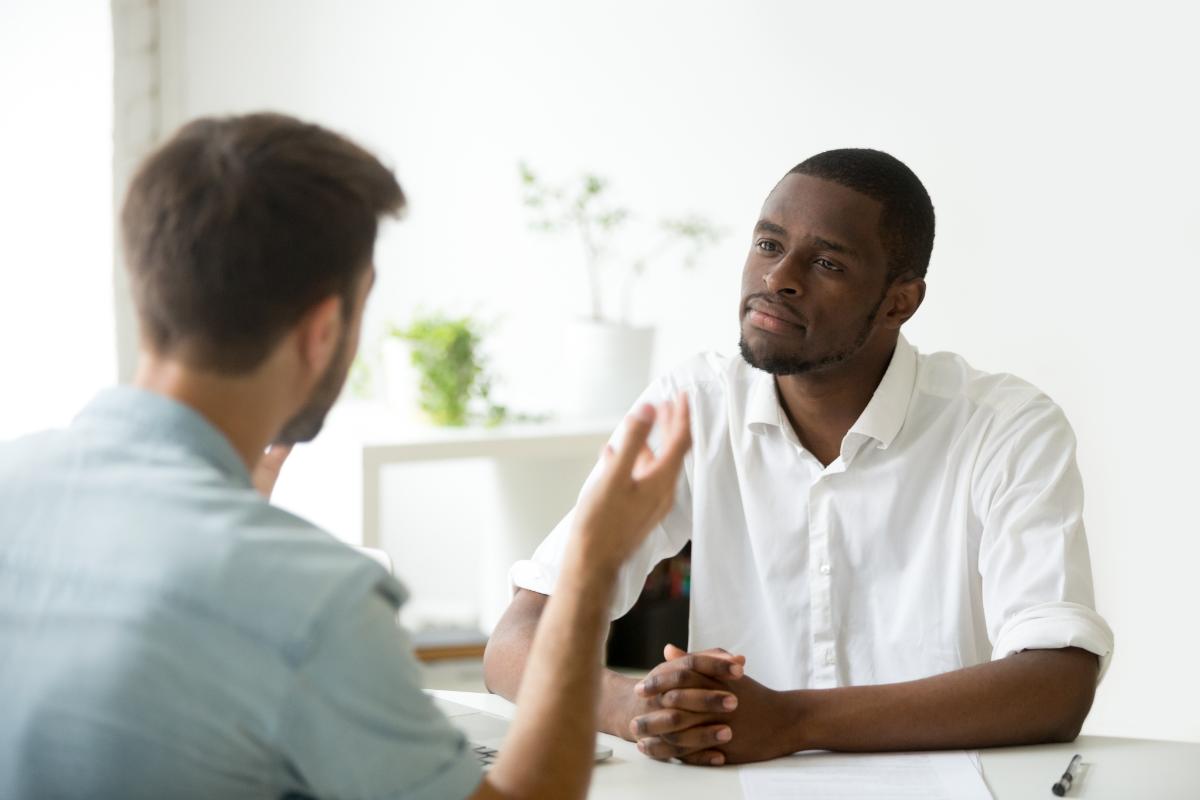 a man talking to his friend about support in sobriety