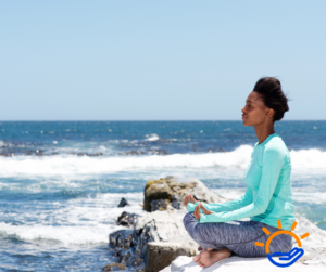 Rehab Blog lady meditation at the beach